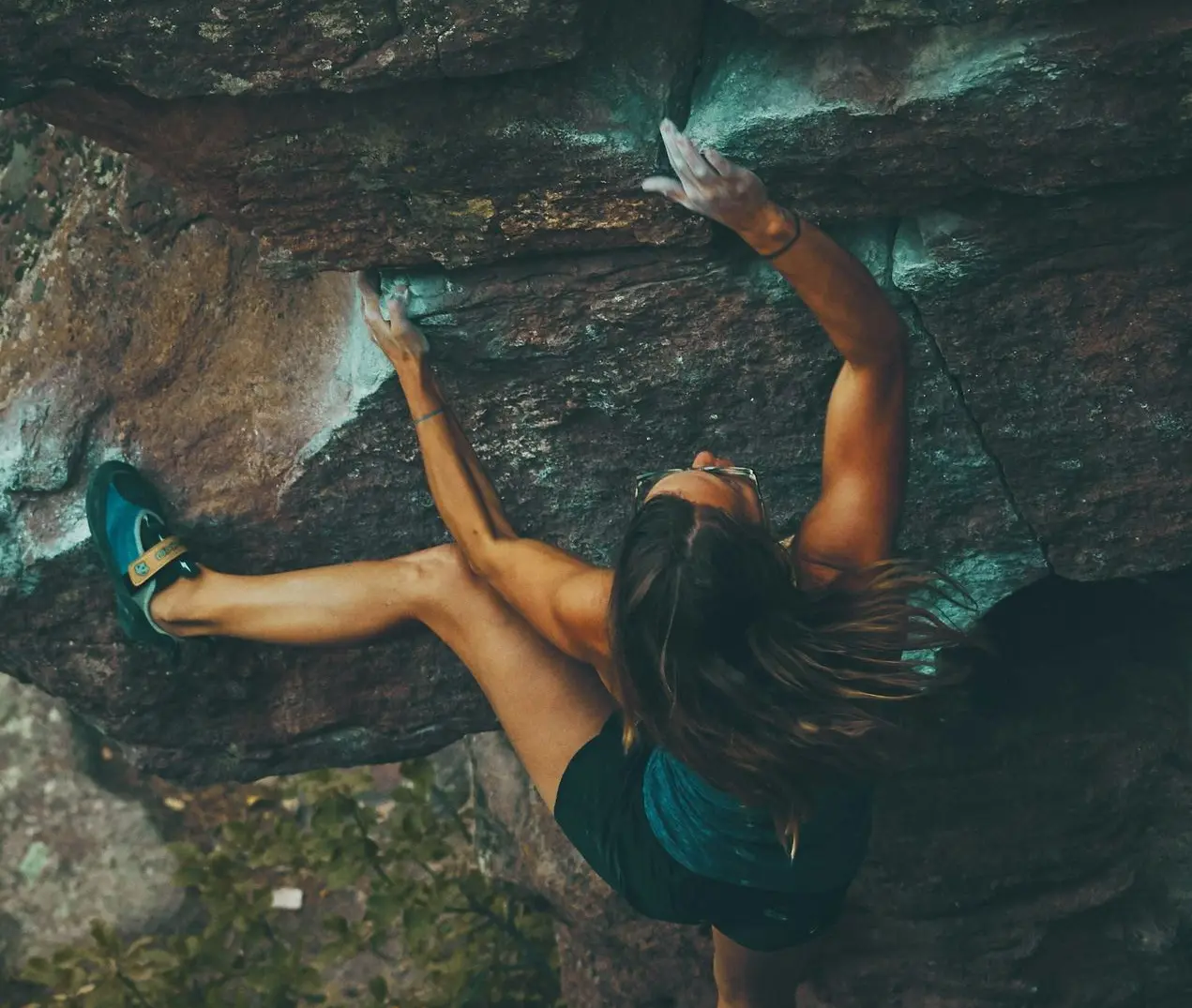 photo of woman climbing mountain